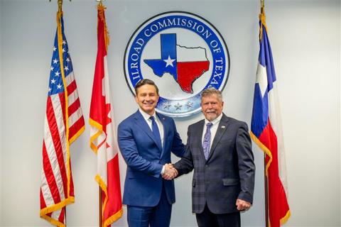 Canadian Conservative Leader Pierre Poilievre and Railroad Commission of Texas Chairman Jim Wright shake hands